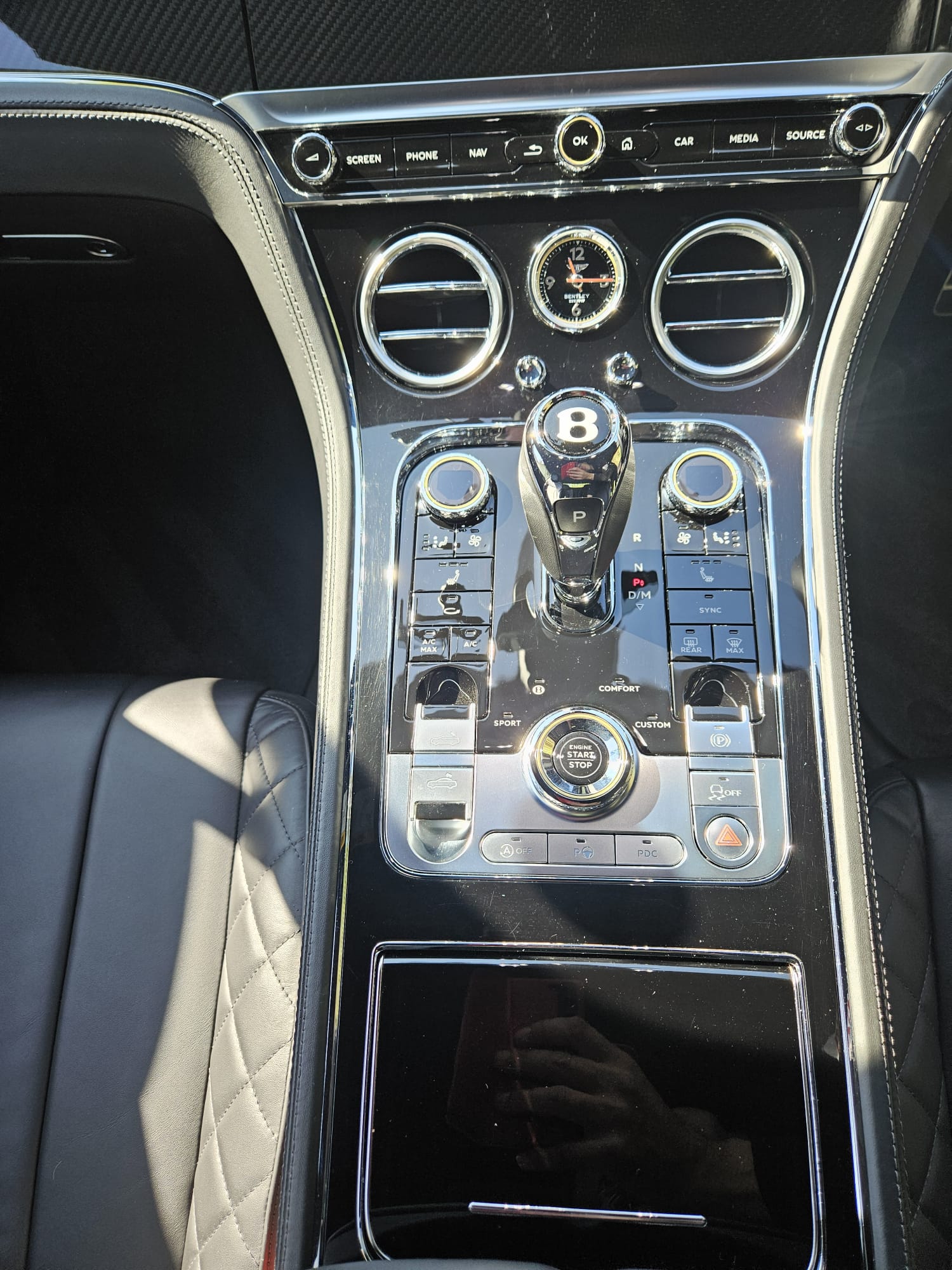 Bentley cabin with quilted leather and polished metal controls after detailing