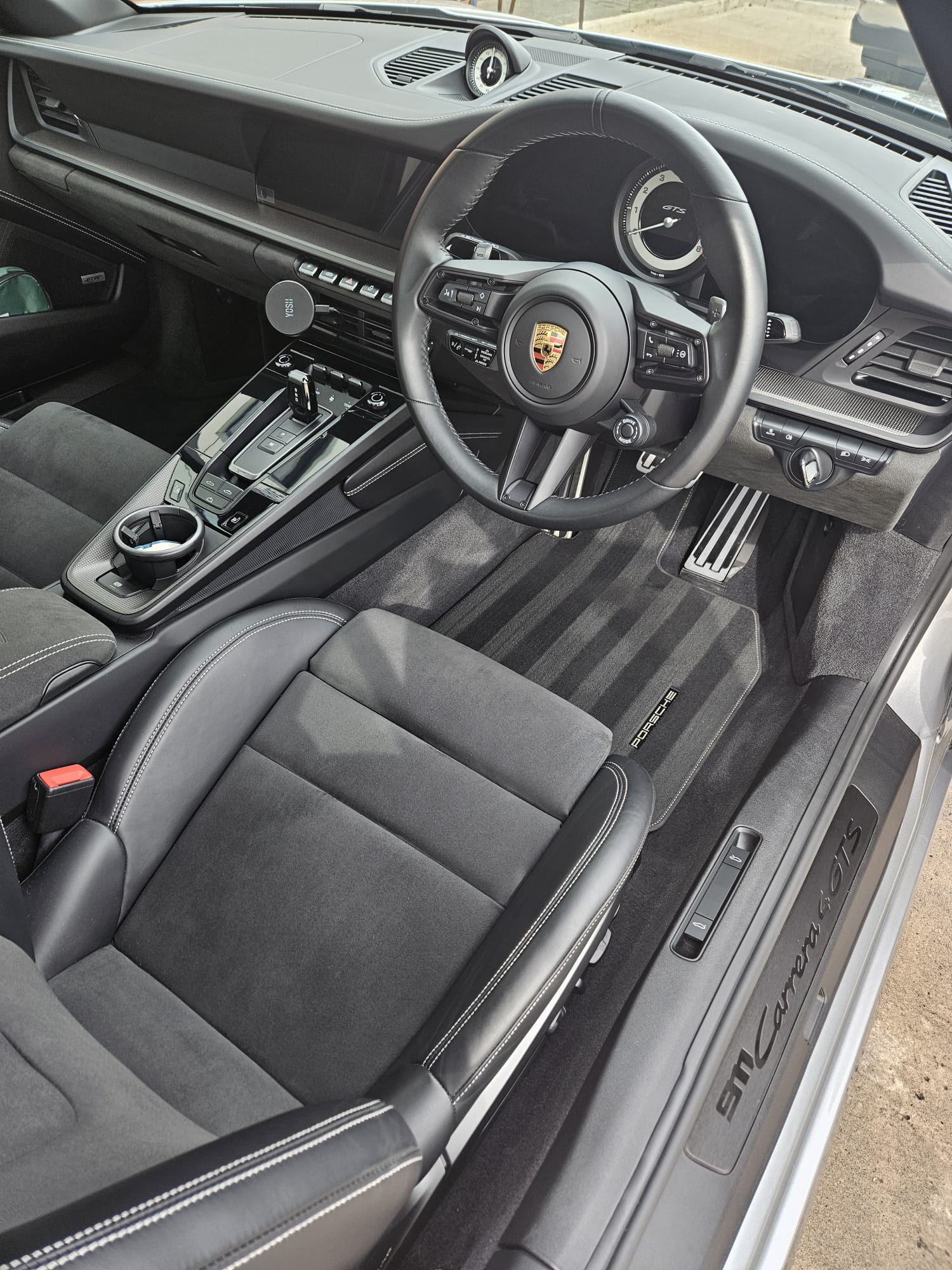 Porsche 911 interior showing cleaned steering wheel, seats and console