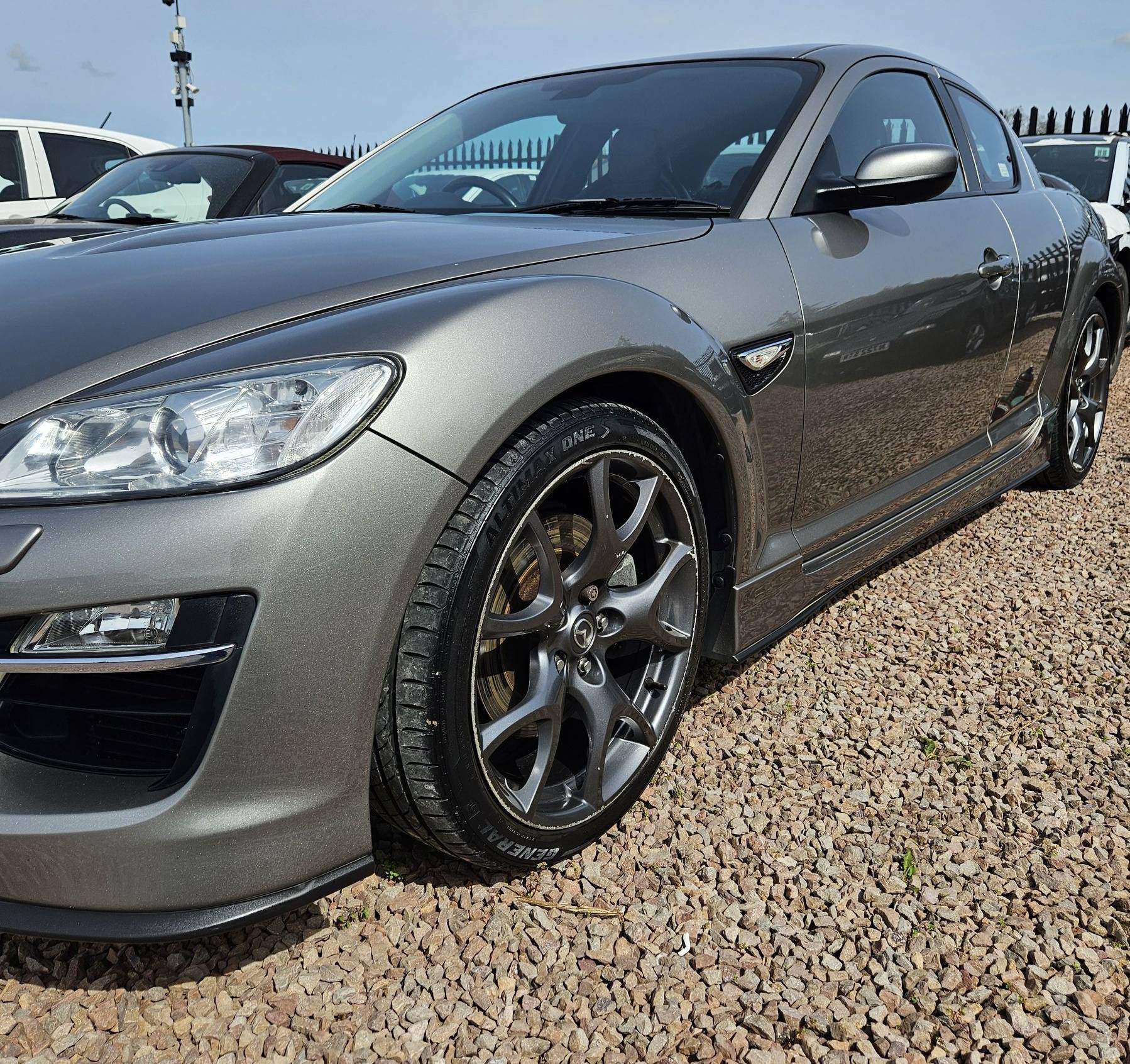 Mazda RX-8 paintwork reflecting cleanly after machine polishing