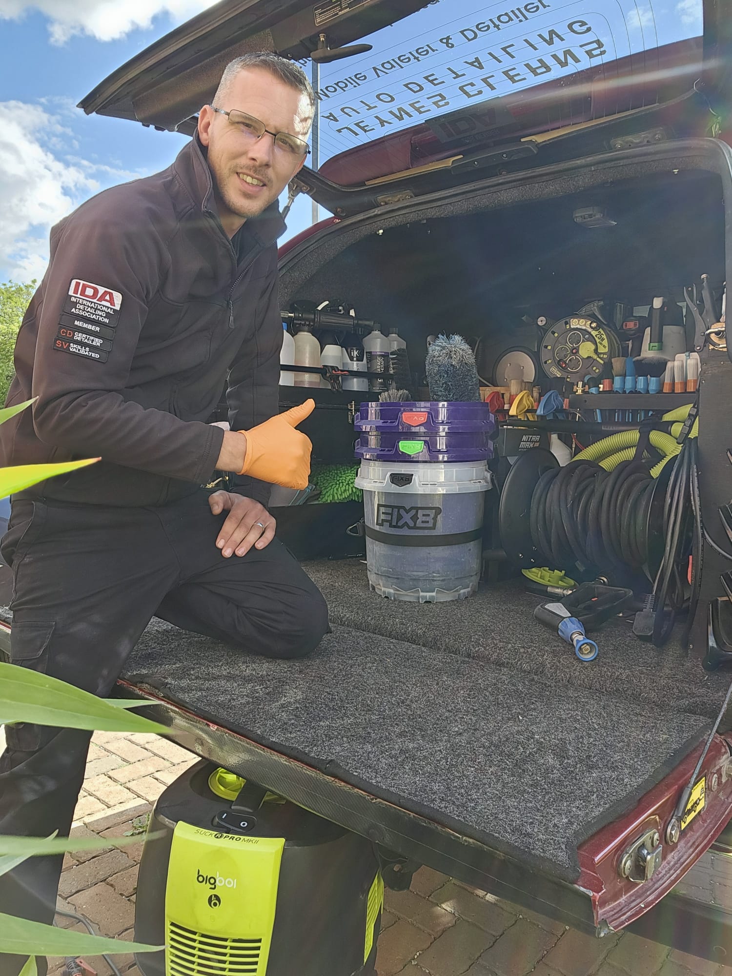 Chris Jeynes at the open boot of his fully equipped mobile detailing vehicle